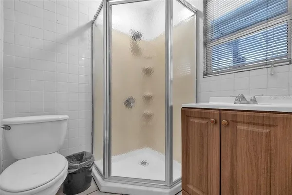 an aerial view of residential houses with outdoor space and street view