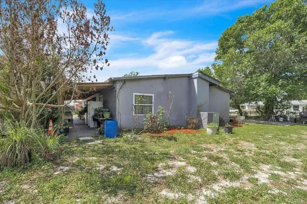 a aerial view of a house with a yard