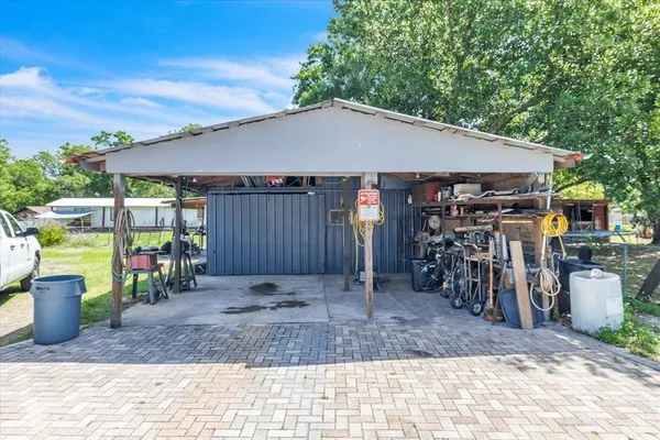 an aerial view of residential houses with outdoor space and river