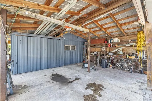 an aerial view of residential houses with city view