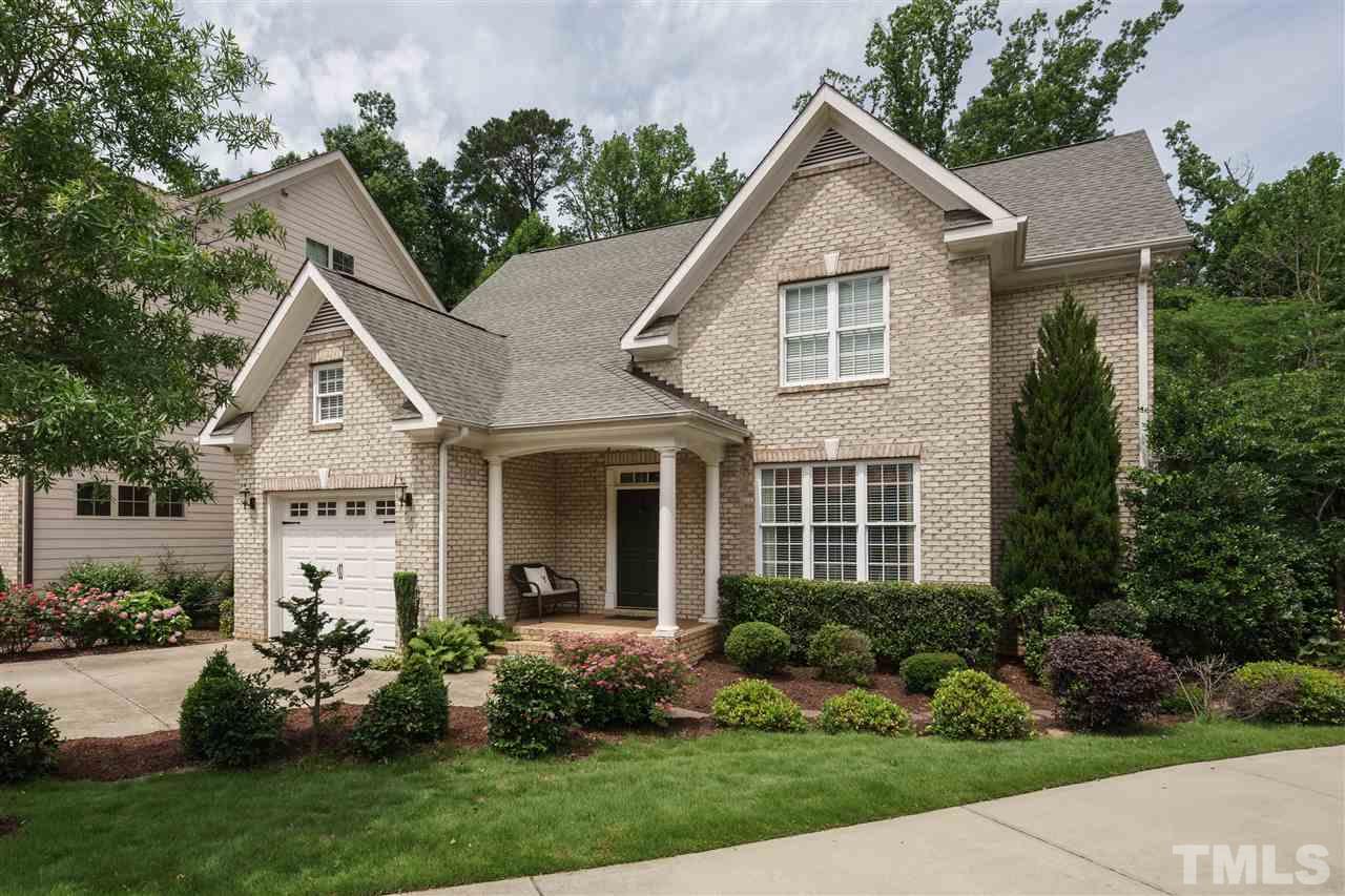 1117 Hobson Court Raleigh, NC 27607 - Photo 1 of 25 a front view of a house with a yard and garage