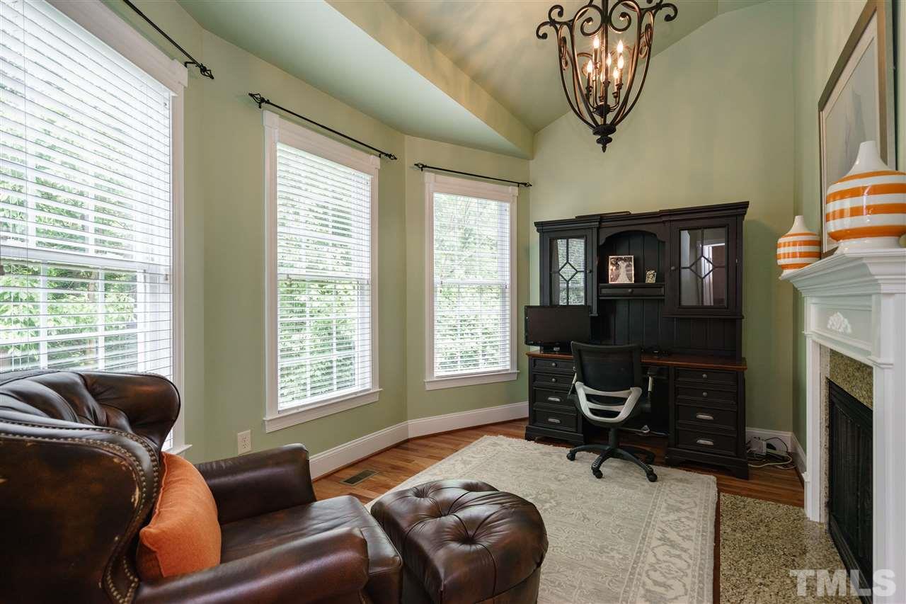 1117 Hobson Court Raleigh, NC 27607 - Photo 15 of 25 a living room with furniture a fireplace and a window