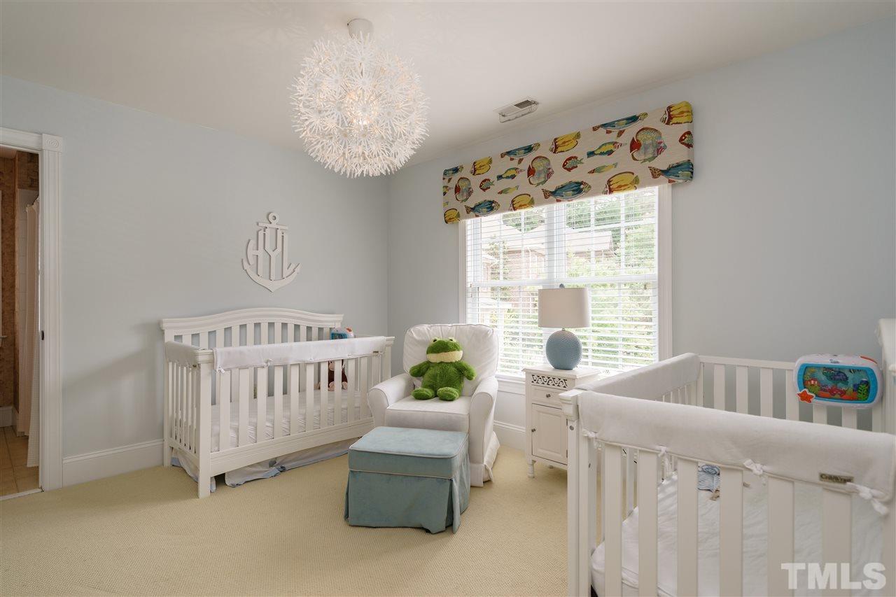 1117 Hobson Court Raleigh, NC 27607 - Photo 18 of 25 a bedroom with furniture and a window
