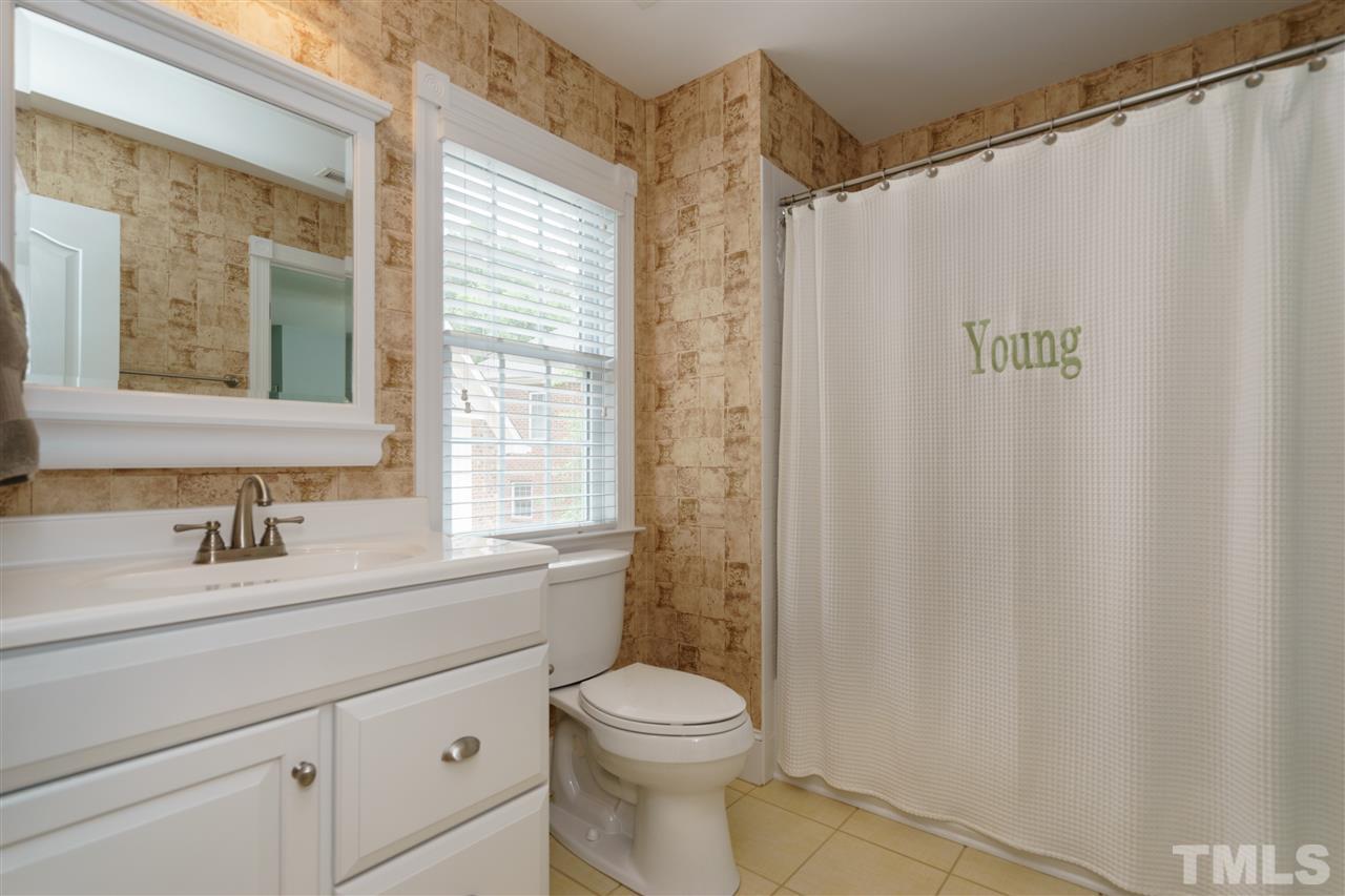 1117 Hobson Court Raleigh, NC 27607 - Photo 19 of 25 a bathroom with a sink a toilet and a window