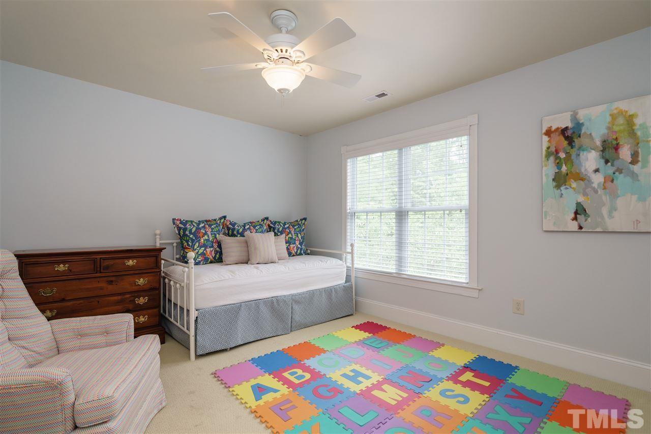 1117 Hobson Court Raleigh, NC 27607 - Photo 20 of 25 a bedroom with a bed and a couch