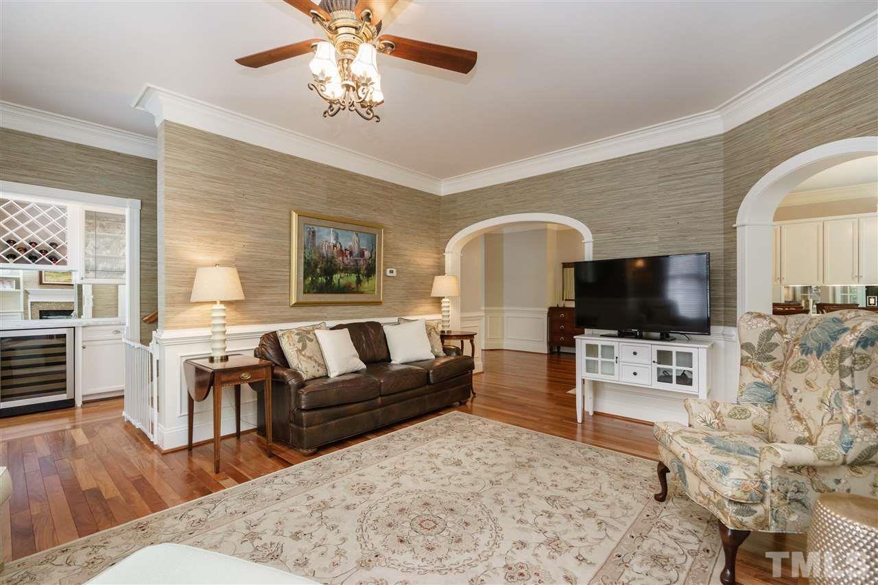 1117 Hobson Court Raleigh, NC 27607 - Photo 6 of 25 a living room with furniture and a flat screen tv