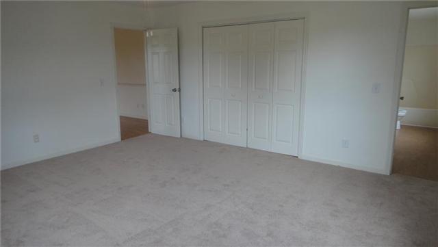 1306 Toliver Lake Road Manchester, TN 37355 - Photo 11 of 20 Master Bedroom sports a big walk-in closet and access to a full bath.