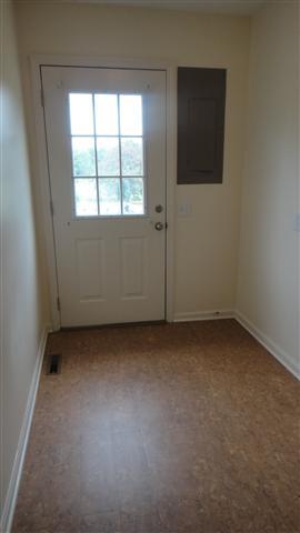 1306 Toliver Lake Road Manchester, TN 37355 - Photo 18 of 20 Utility room has fresh paint, new cork floors and door to outside.