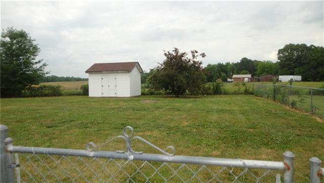 1306 Toliver Lake Road Manchester, TN 37355 - Photo 20 of 20 With an affordable price tag, this home has a fenced yard and outbuilding for all those lawn tools.