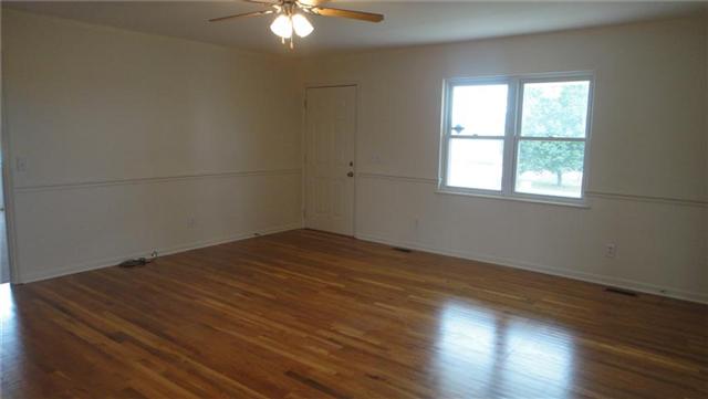 1306 Toliver Lake Road Manchester, TN 37355 - Photo 3 of 20 Spacious Living Room enjoys fresh paint, new windows overlooking the front yard and refinished hardwoods.