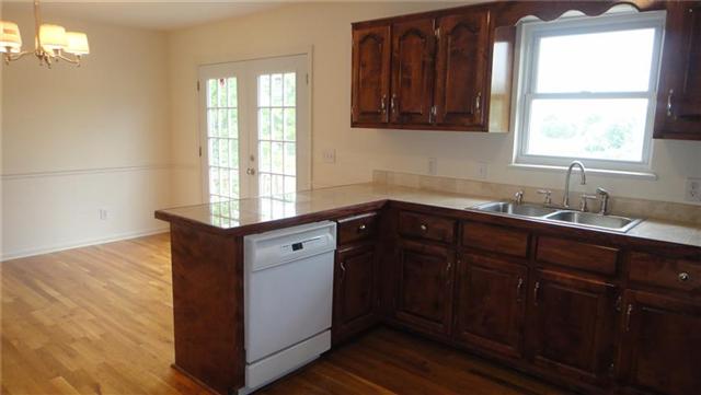 1306 Toliver Lake Road Manchester, TN 37355 - Photo 8 of 20 Handy snack bar conveniently serves the dining room.