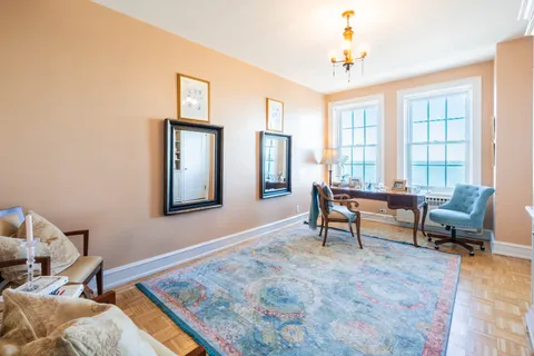 a living room with furniture and a window
