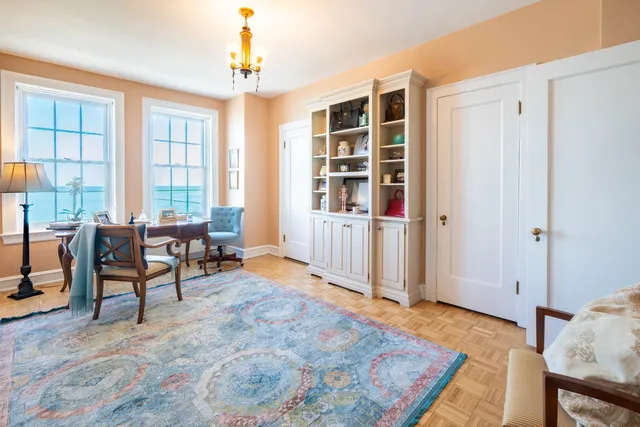 a view of a livingroom with furniture and a window
