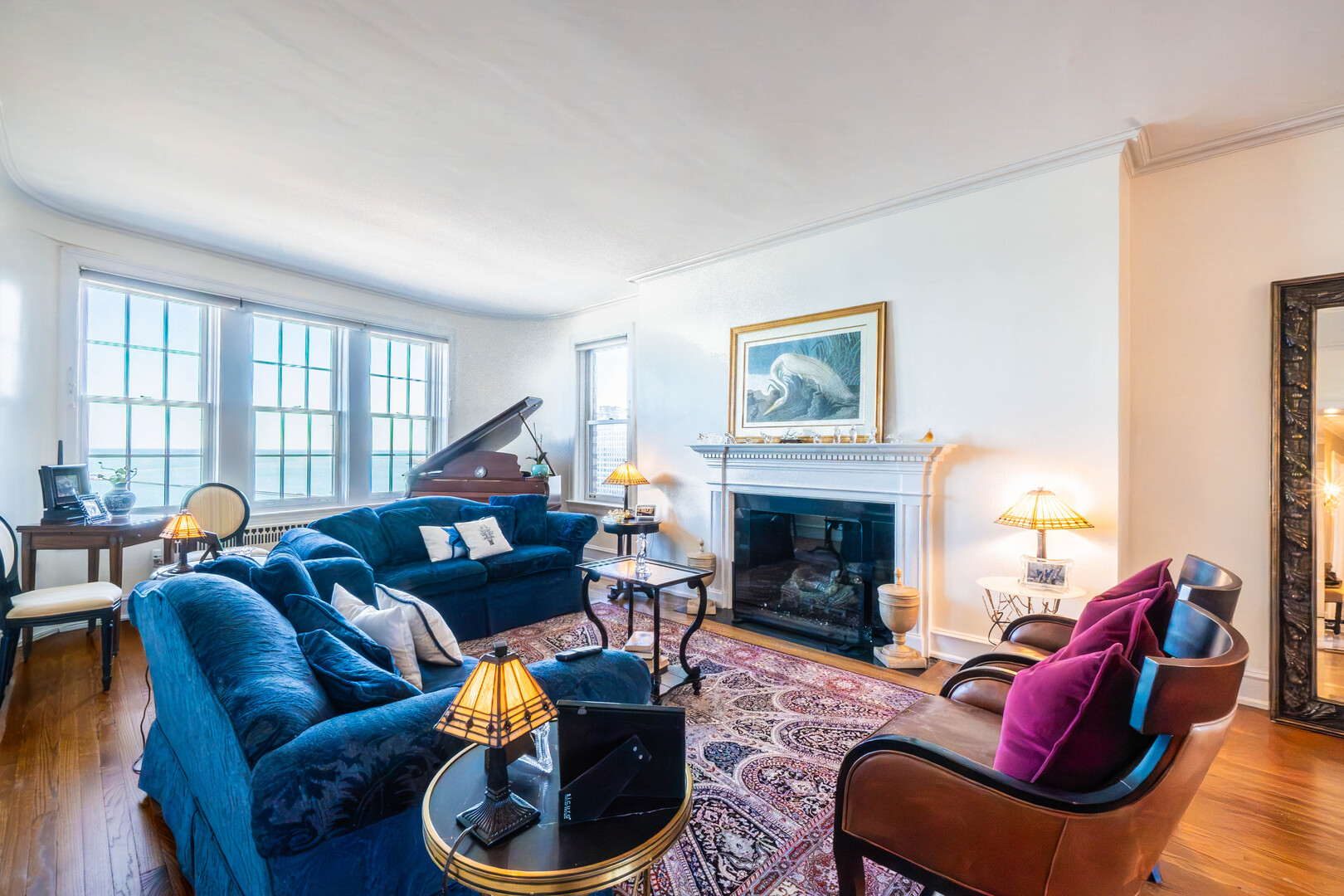 1120 North Lake Shore Drive, Unit 15A Chicago, IL 60611 - Photo 2 of 29 a living room with furniture a fireplace and a large window
