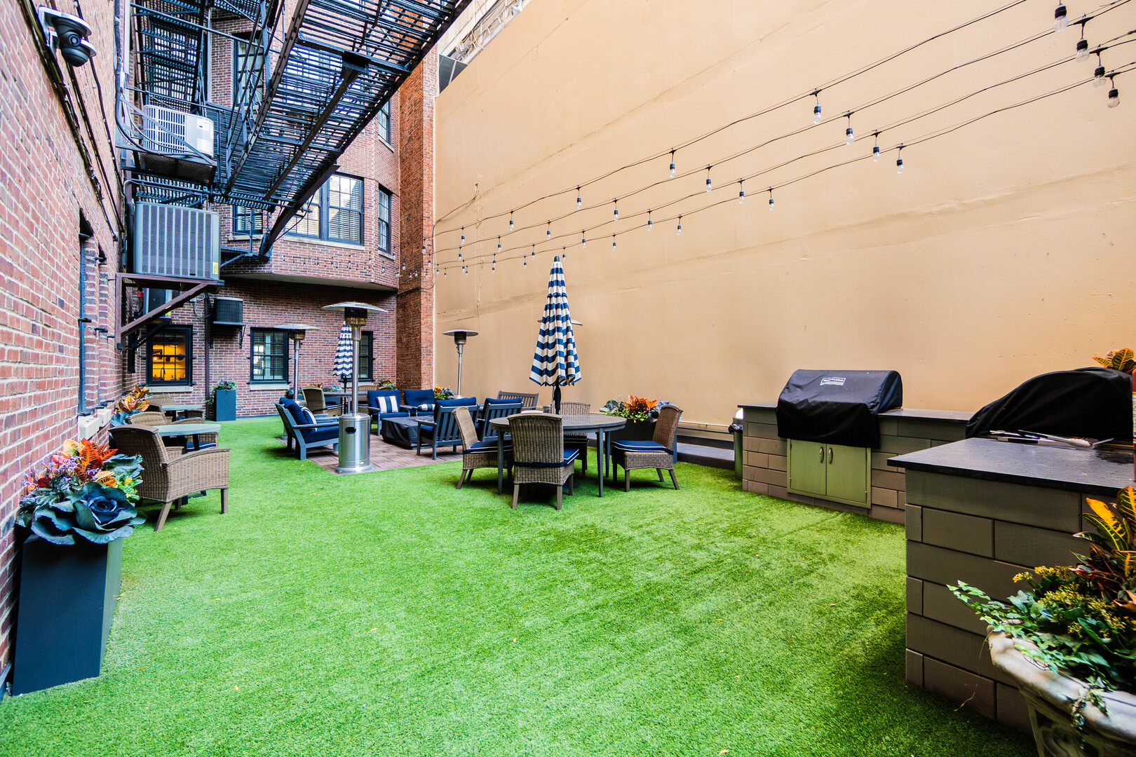 1120 North Lake Shore Drive, Unit 15A Chicago, IL 60611 - Photo 23 of 29 a view of a chairs and tables in the backyard of the house