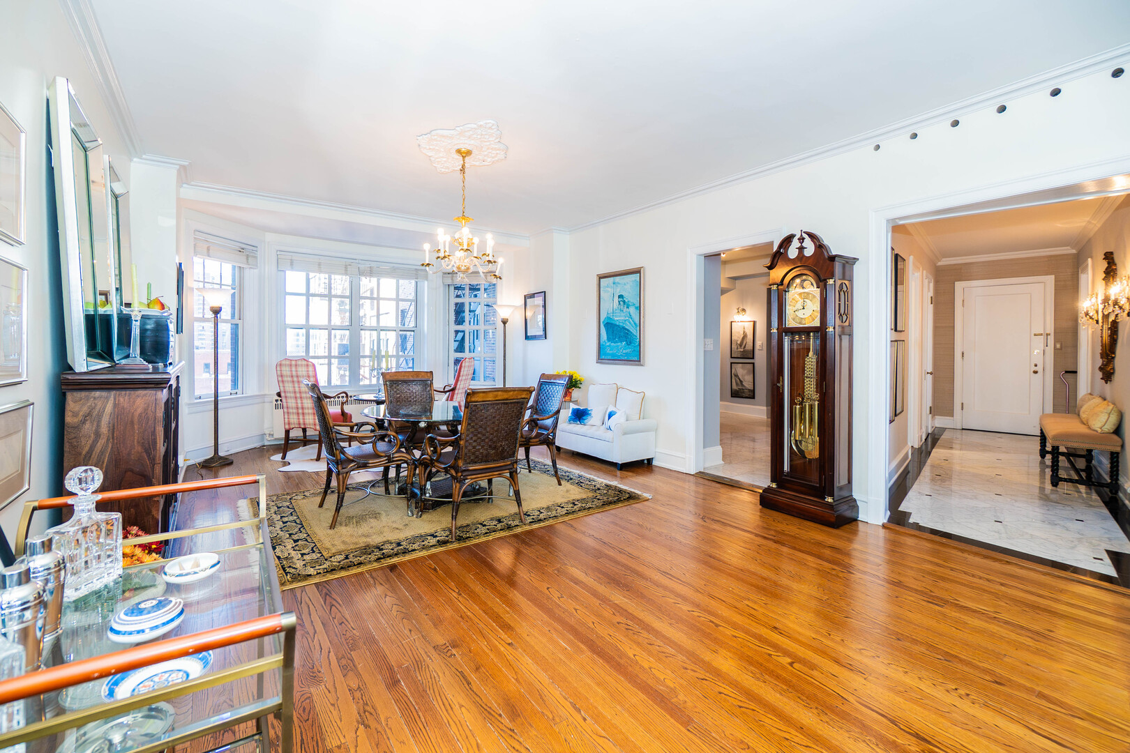 1120 North Lake Shore Drive, Unit 15A Chicago, IL 60611 - Photo 6 of 29 a view of a dining room and livingroom with furniture wooden floor a chandelier