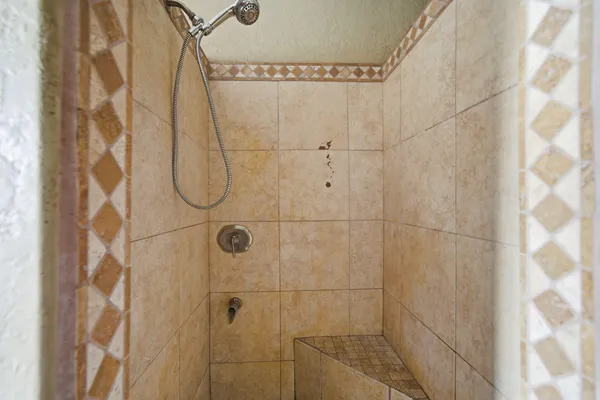 a bathroom with mirror sink and window