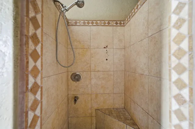 a bathroom with mirror sink and window