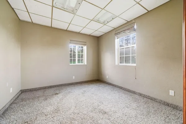an empty room with windows