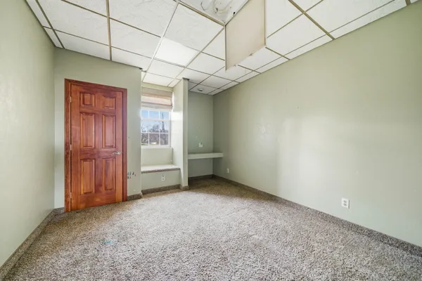 a view of livingroom with an empty room