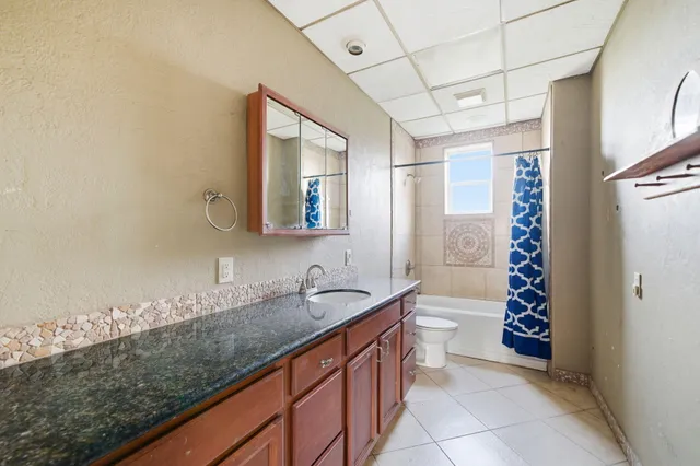 a view of a garage with rack and bicycle