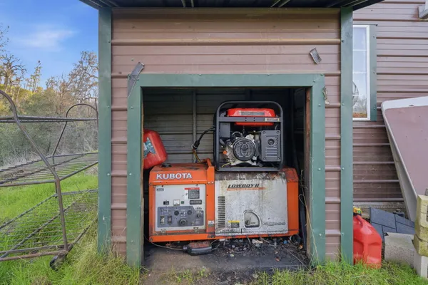 a backyard of a house with table and chairs