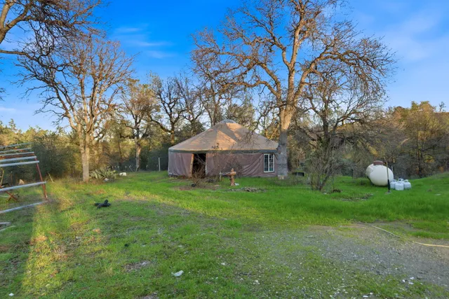 a view of a backyard with a patio