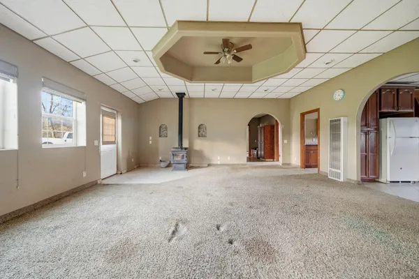 a view of an empty room and a window