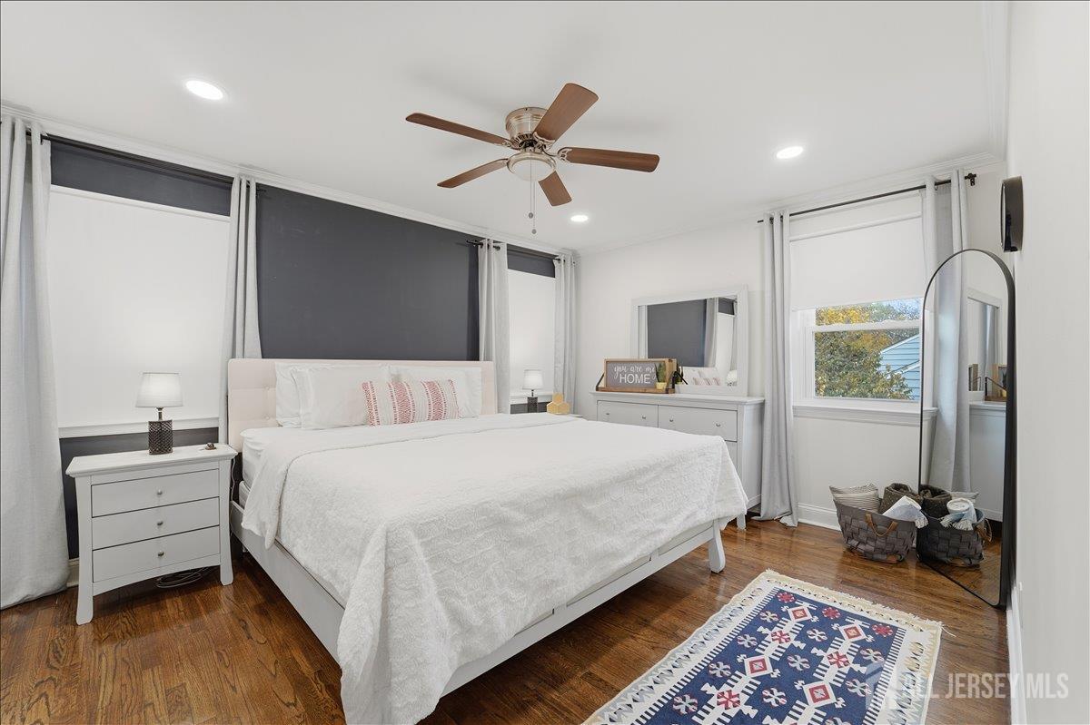 10 Maplehurst Lane Piscataway, NJ 08854 - Photo 11 of 28 a bedroom with a bed and wooden floor