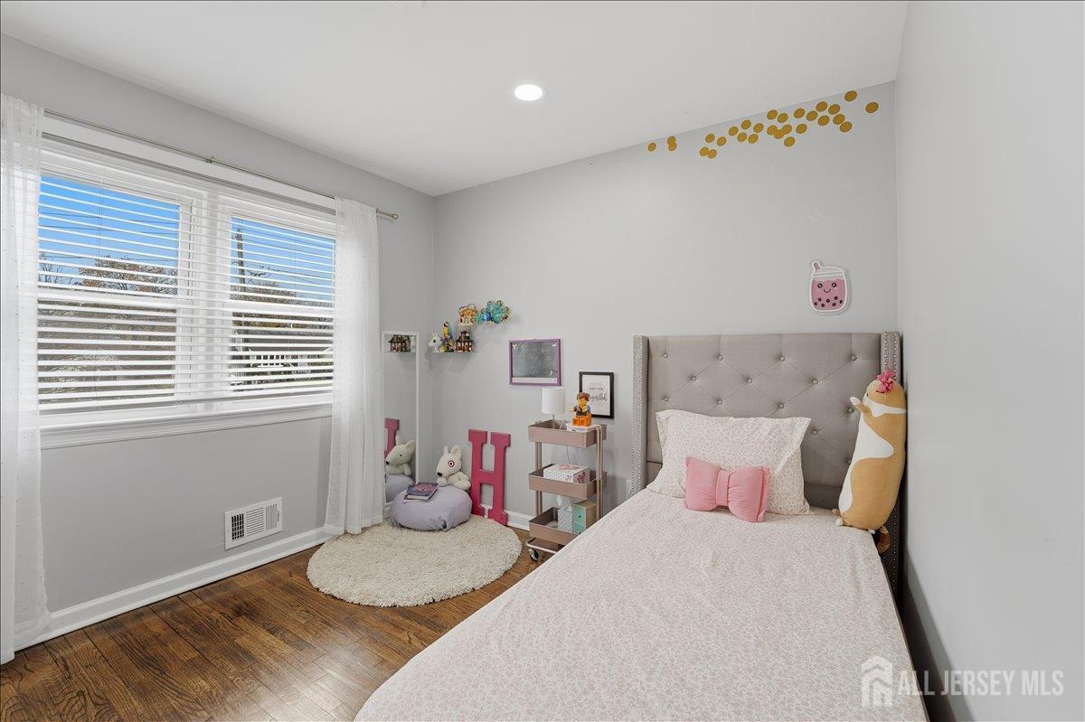 10 Maplehurst Lane Piscataway, NJ 08854 - Photo 16 of 28 a bedroom with a bed and a window