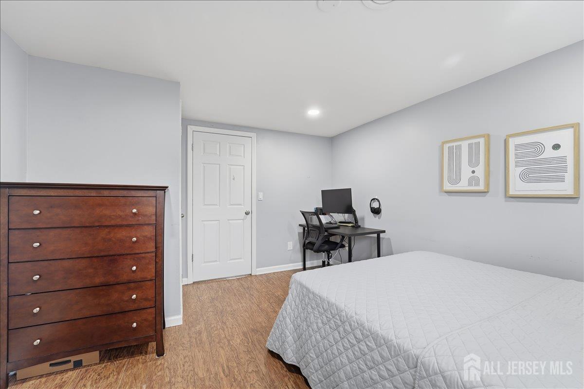 10 Maplehurst Lane Piscataway, NJ 08854 - Photo 20 of 28 a bedroom with a bed and a tv on table