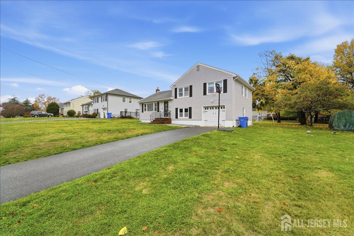 10 Maplehurst Lane Piscataway, NJ 08854 - Photo 2 of 28 a front view of a house with a yard