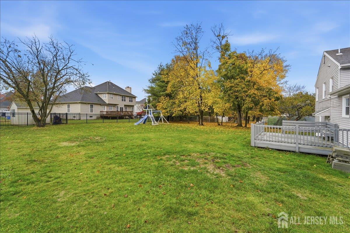 10 Maplehurst Lane Piscataway, NJ 08854 - Photo 25 of 28 a view of a house with a yard and sitting area