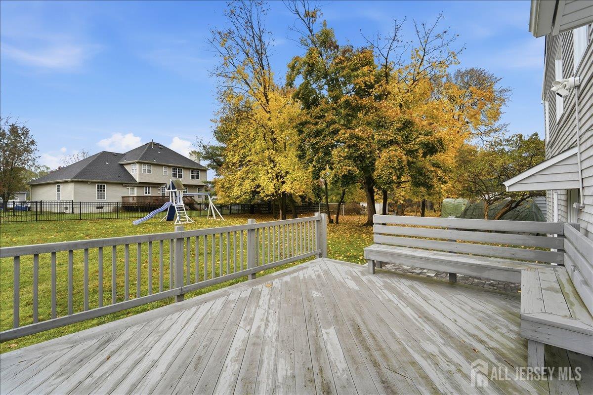 10 Maplehurst Lane Piscataway, NJ 08854 - Photo 27 of 28 a view of house with a garden and trees