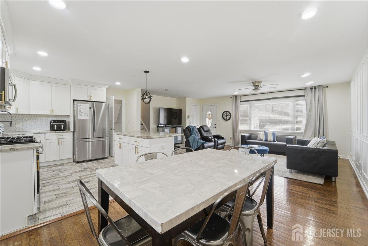 10 Maplehurst Lane Piscataway, NJ 08854 - Photo 5 of 28 a large kitchen with a table and chairs