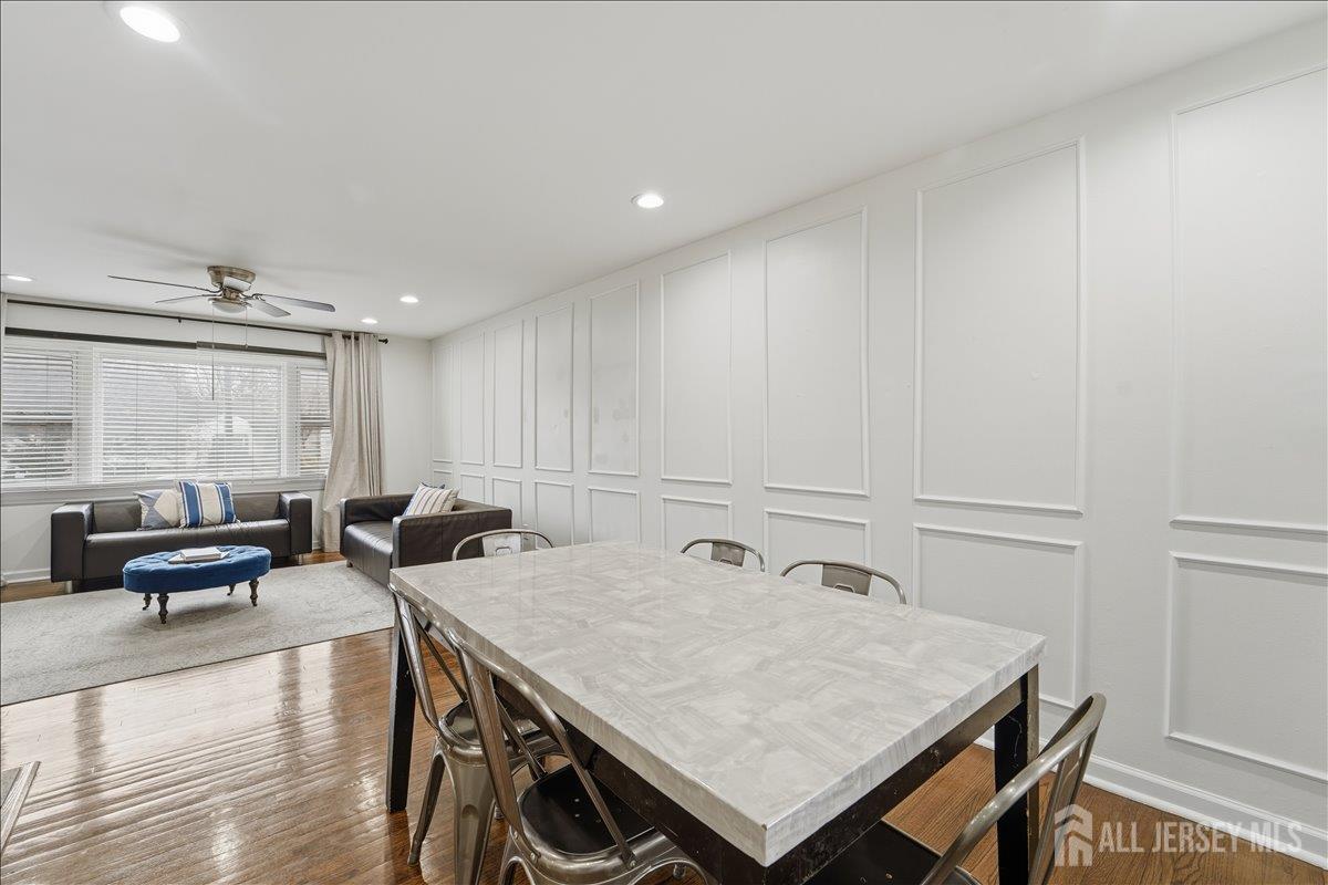 10 Maplehurst Lane Piscataway, NJ 08854 - Photo 7 of 28 a view of a dining room with furniture and wooden floor