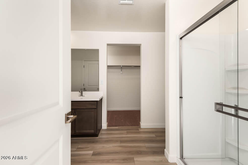 1094 Feliz Street Florence, AZ 85132 - Photo 13 of 13 a view of bathroom with a sink and mirror