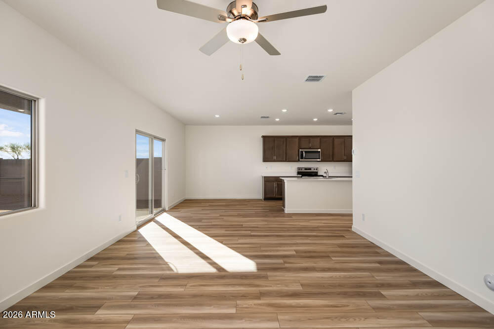 1094 Feliz Street Florence, AZ 85132 - Photo 8 of 13 a view of kitchen with sink and wooden floor