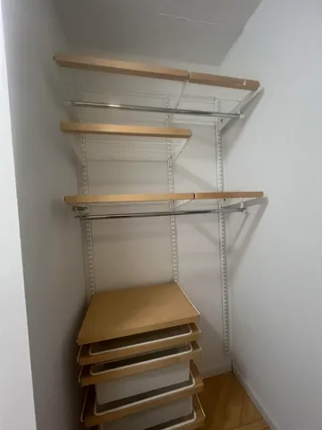 a utility room with water heater on wall