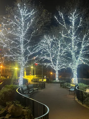 a backyard of a house with table and chairs and a fire pit