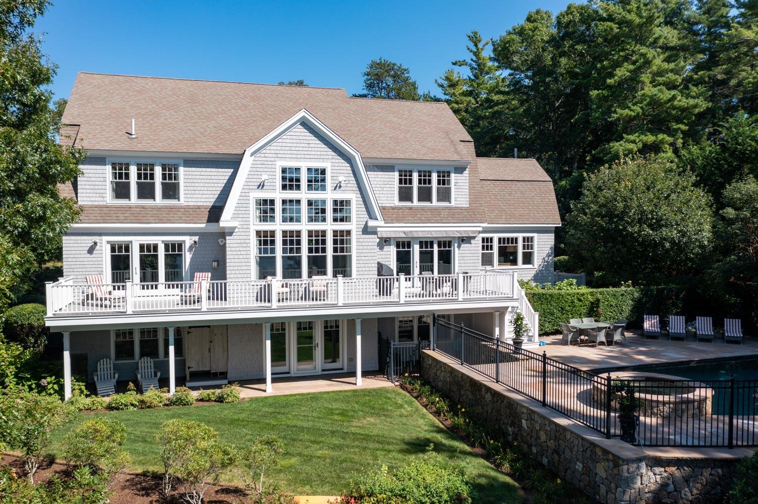 172 Bay Road Cotuit, MA 02635 - Photo 1 of 36 a aerial view of a house with swimming pool and sitting area
