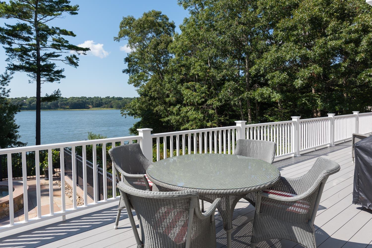 172 Bay Road Cotuit, MA 02635 - Photo 26 of 36 a view of a chair and table in the balcony