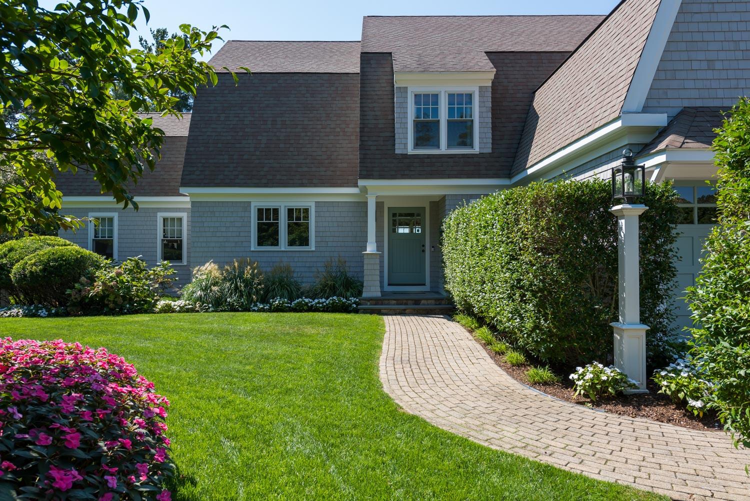 172 Bay Road Cotuit, MA 02635 - Photo 33 of 36 a front view of a house with garden