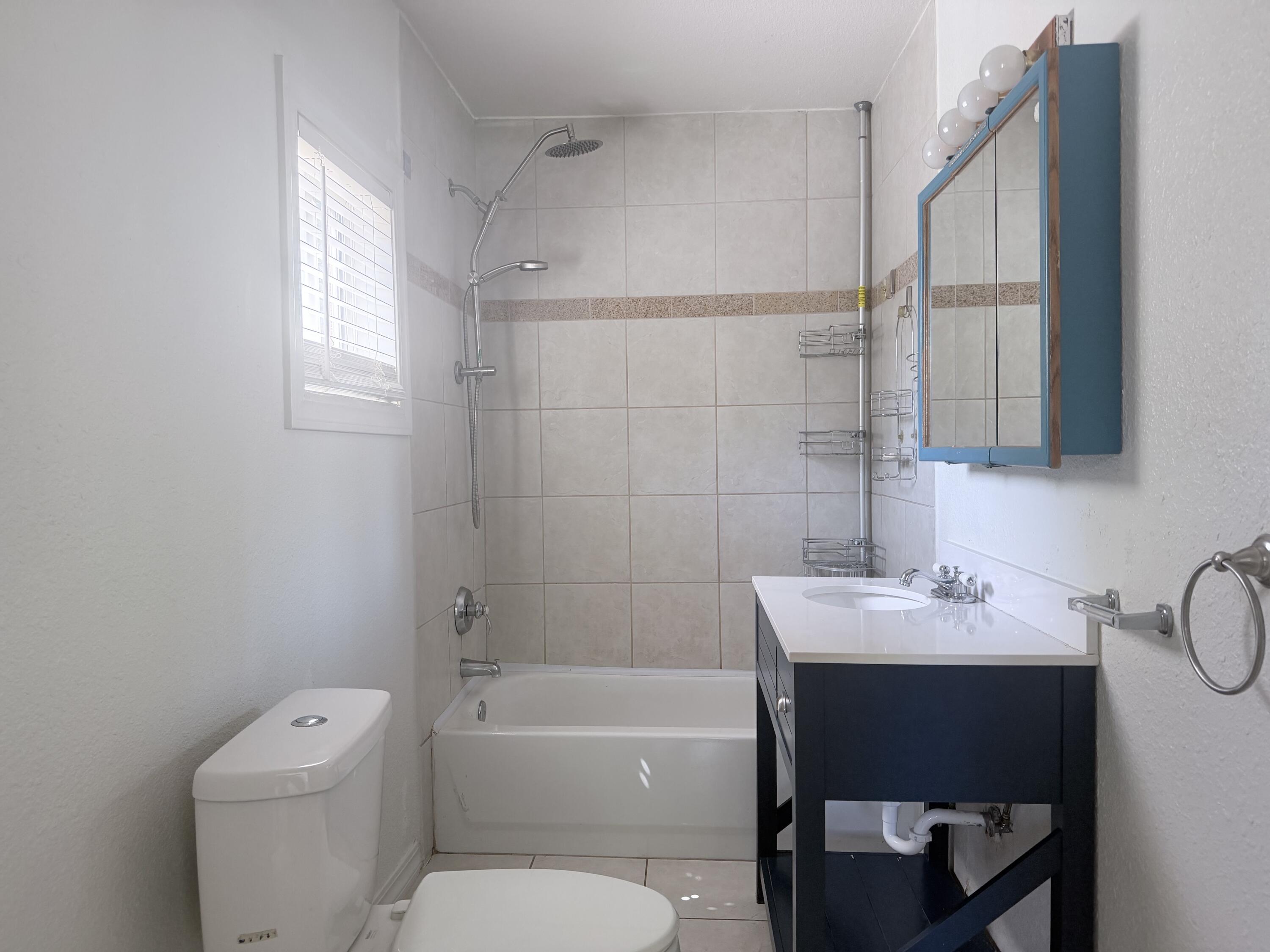 2230 El Reno Lane Redding, CA 96001 - Photo 20 of 27 a bathroom with a sink a toilet and shower