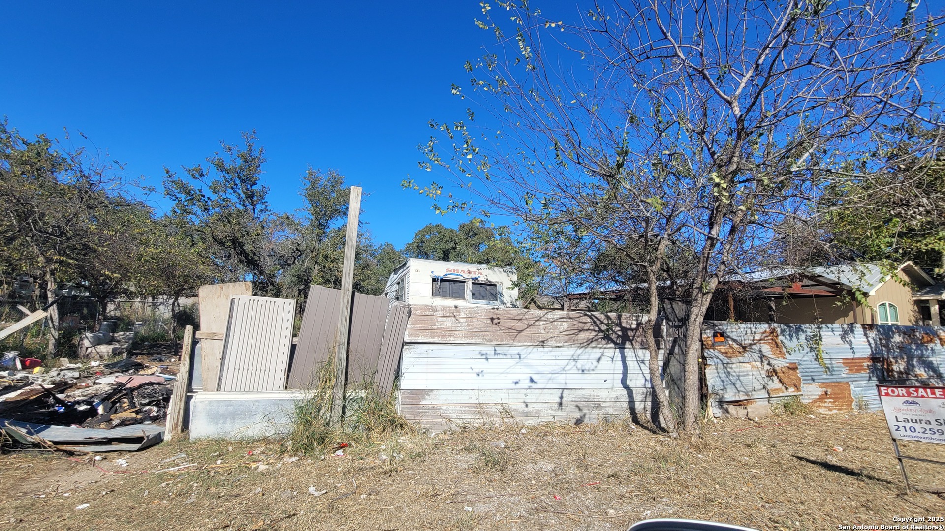 126 Viewpoint Drive Poteet, TX 78065 - Photo 4 of 6 a view of a house with a yard covered with snow