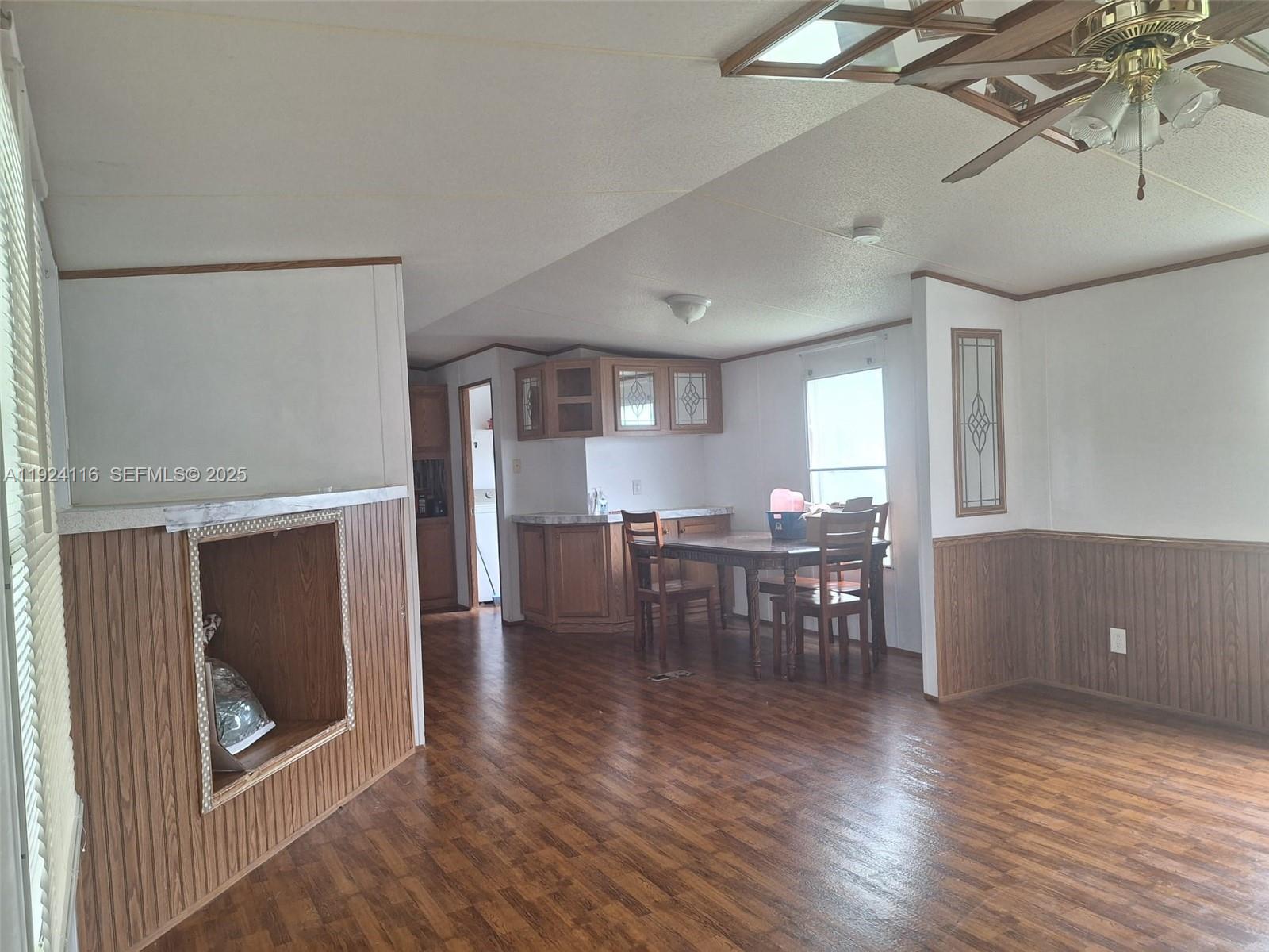 35303 Southwest 180th Avenue, Unit 399 Homestead, FL 33034 - Photo 6 of 6 a view of a dining room with furniture and wooden floor