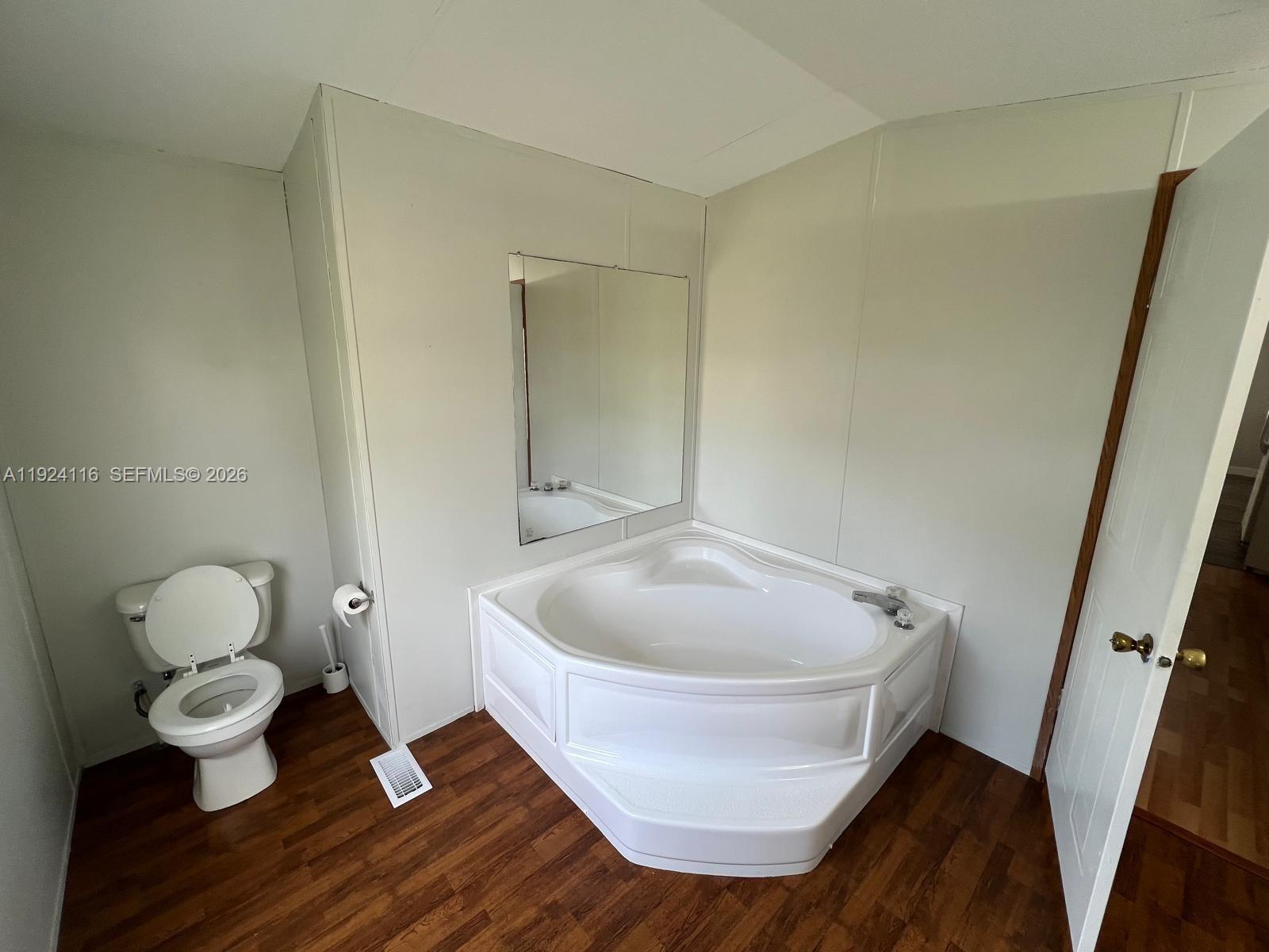 35303 Southwest 180th Avenue, Unit 399 Homestead, FL 33034 - Photo 7 of 16 a bathroom with a sink and a mirror