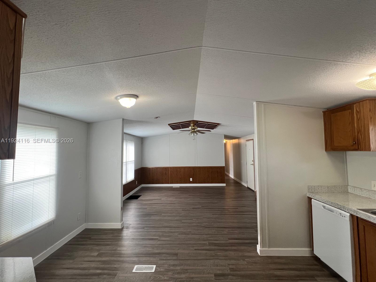 35303 Southwest 180th Avenue, Unit 399 Homestead, FL 33034 - Photo 10 of 16 a view of a room with wooden floor