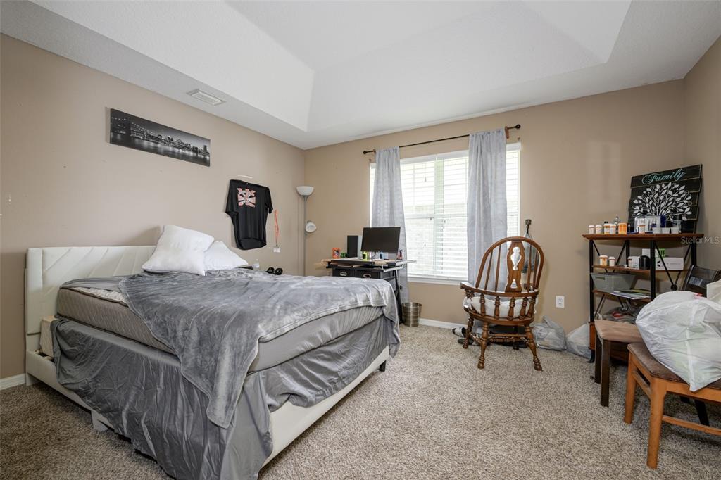 11 Riddle Drive Palm Coast, FL 32164 - Photo 15 of 33 a bedroom with bed and a window