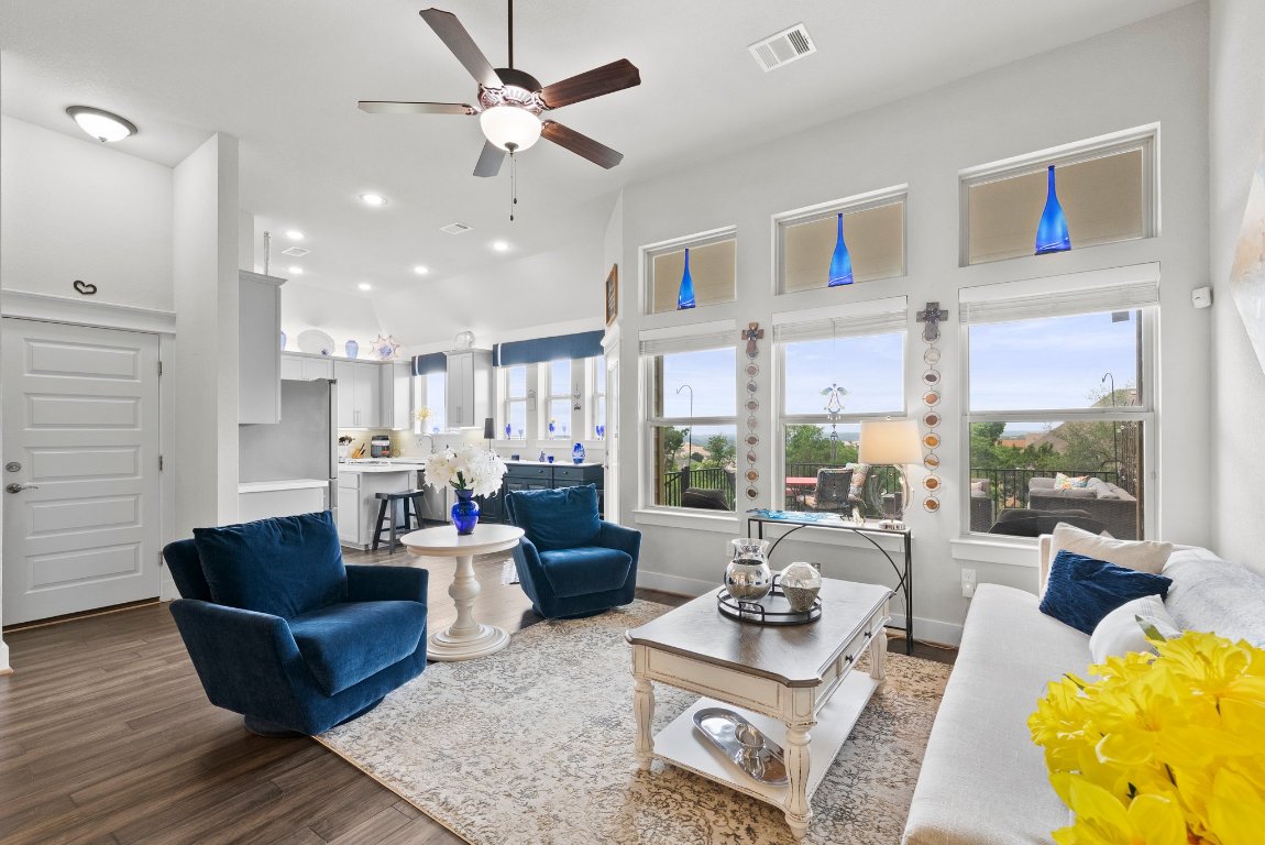 a living room with furniture and a large window